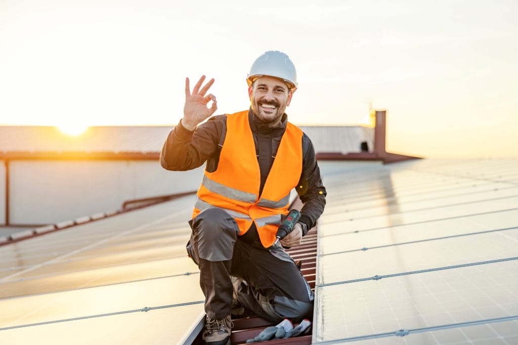 A Roofing Expert On Top Of A Roof